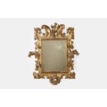 A baroque giltwood mirror, 18th century, Italian,