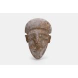 An Ancient Egyptian carved cedar sarcophagus mask, Late Period, circa 664-332 BCE,