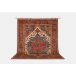 A wool carpet of antique Persian Heriz design, of recent manufacture,