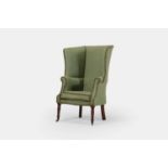 A Regency upholstered wing armchair, circa 1810,