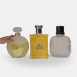 Three oversized glass perfume and aftershave advertising bottles, circa 1992,