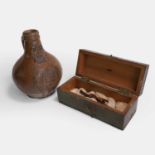 A salt-glazed stoneware witch's bellarmine bottle, 17th century,