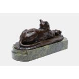 John Macallan Swan RA (British, 1846-1910), a bronze sculpture of a reclining cat clutching a ball,
