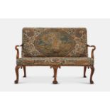 A George II walnut sofa, 18th century and later,