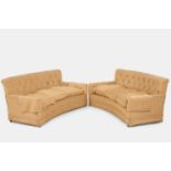 A pair of button-upholstered sofas by Howard & Sons, first half of the 20th century,