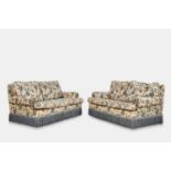 A pair of two-seater sofas, of recent manufacture,