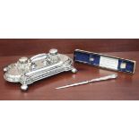 A silver-plated ink stand together with a silver-handled letter opener - 1. the Edwardian Mappin &