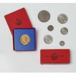 A small group of GB British coins and medals - comprising a circulated 1935 silver Crown (VF+); four