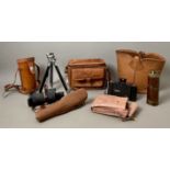 A leather bag containing a 19th century brass draw telescope - with wooden hand piece and