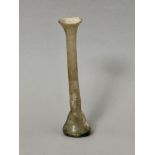 Antiquities: a Roman glass 'candlestick' unguentarium - c.100-200AD, the conical base extending into