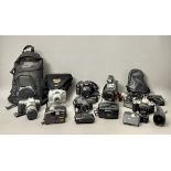 A group of camera equipment - a Sony Handycam Pro no 503987; a Nikon F65 with 52mm lens in a leather