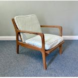 A 1960s Danish teak open lounge armchair - with a low slatted back, shaped arms and sprung seat with
