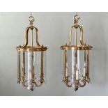 A good pair of large, gilt brass and glass Regency-style hall lanterns - the cylindrical frames with