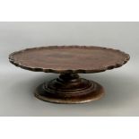 A Georgian style mahogany lazy susan - mid-20th century, the circular top with a Chippendale rim,