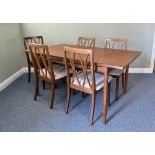 A vintage G Plan teak extending dining table and five G Plan dining chairs - the table with two