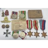 BRITISH WW2 MEDALS TO INCLUDE DEFENCE & WAR MEDAL WITH RIBBONS IN A CARD BOX ADDRESSED TO MR R