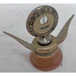 FORD BOYCE MOTO METER RADIATOR CAP ON A TURNED WOODEN BASE,
