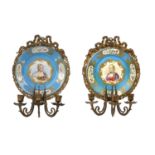A Pair of Gilt-Metal-Mounted Sèvres-Style Porcelain Wall Sconces, circa 1900, of circular form