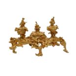A French Gilt-Bronze Inkstand, in Rococo style, the central covered compartment flanked by two