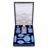 A George V and George VI Silver and Enamel-Mounted Dressing-Table Service, by W. G. Sothers Ltd., Bi