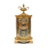 A French Champleve Enamel Striking Mantel Clock, circa 1890, case surmounted by an urn finial,
