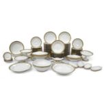 A Limoges Porcelain Dinner Service, 20th century, with tooled gilt borders and with trailing