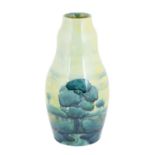 William Moorcroft (1872-1945): A Hazeldene Landscape Pattern Vase, green painted signature and