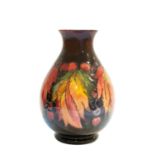 William Moorcroft (British, 1872-1945): A Flambé Leaf and Berry Pattern Vase, impressed MADE IN