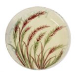 William Moorcroft (1872-1945): A Waving Corn Pattern Plate, on a pale green ground, impressed