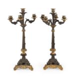 A Pair of Patinated and Parcel-Gilt Bronze Five-Light Candelabra, 19th Century, with gadrooned urn-