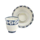 A St Cloud Porcelain Beaker on Trembleuse Stand, circa 1730, fluted and painted in underglaze blue