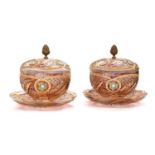 A Pair of Bohemian Ruby Flash Glass Bowl, Cover and Stand, all over cut, painted and gilt with