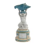A Copeland Porcelain Figural Centrepiece, 19th century, modelled as a merboy holding a conche shell,
