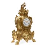 A French Gilt Metal Striking Mantel Clock, circa 1890, the large case with scroll and shell motif