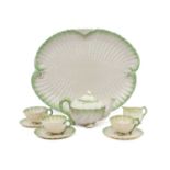 A Belleek Porcelain Cabaret Set, 19th century, shell moulded, edged in blush green, black printed