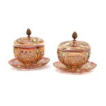 A Pair of Bohemian Ruby-Flashed Glass Bowls, Covers and Stands, all over cut, painted and gilt