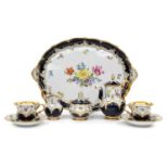 A Meissen Porcelain Tête-à-Tête, 20th century, ground in cobalt blue, with gilded moulding and