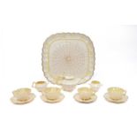A Belleek Porcelain Cabaret Set, 19th century, moulded with prunus blossom, the tray with a spider