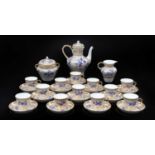 A Sèvres-Style Porcelain Coffee Set, ground with honeycomb gilding and enamelled in purple