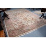 A Ziegler Design Carpet, the field with large palmettes and leafy vines, framed by borders of