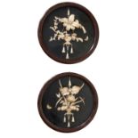 A Pair of Japanese Meiji Period Bone Shibayama Panels, within circular painted lacquer frames,
