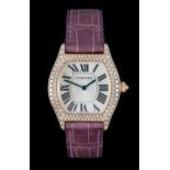 Cartier: A Good Lady's 18 Carat Rose Gold Diamond Set Tonneau Shaped Wristwatch, signed Cartier,
