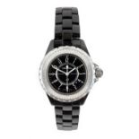 Chanel: A Lady's Black Ceramic Calendar Centre Seconds Diamond Set Wristwatch, signed Chanel, Paris,