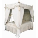 A Victorian White Painted Metal and Brass Four-Poster Double Bed, with drapes and covers, 155cm by