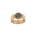 A 9 Carat Gold Composite Black Opal Ring the oval composite black opal plaque in a yellow rubbed