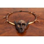 Natural History: An Unusual Early 20th Century Ifugao Monkey Skull Tribal Necklace, with braided