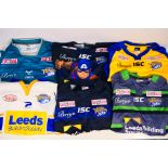 Six Leeds Rhinos rugby shirts, sizes 2XL and 4XL. Generally good condition with wear to some.