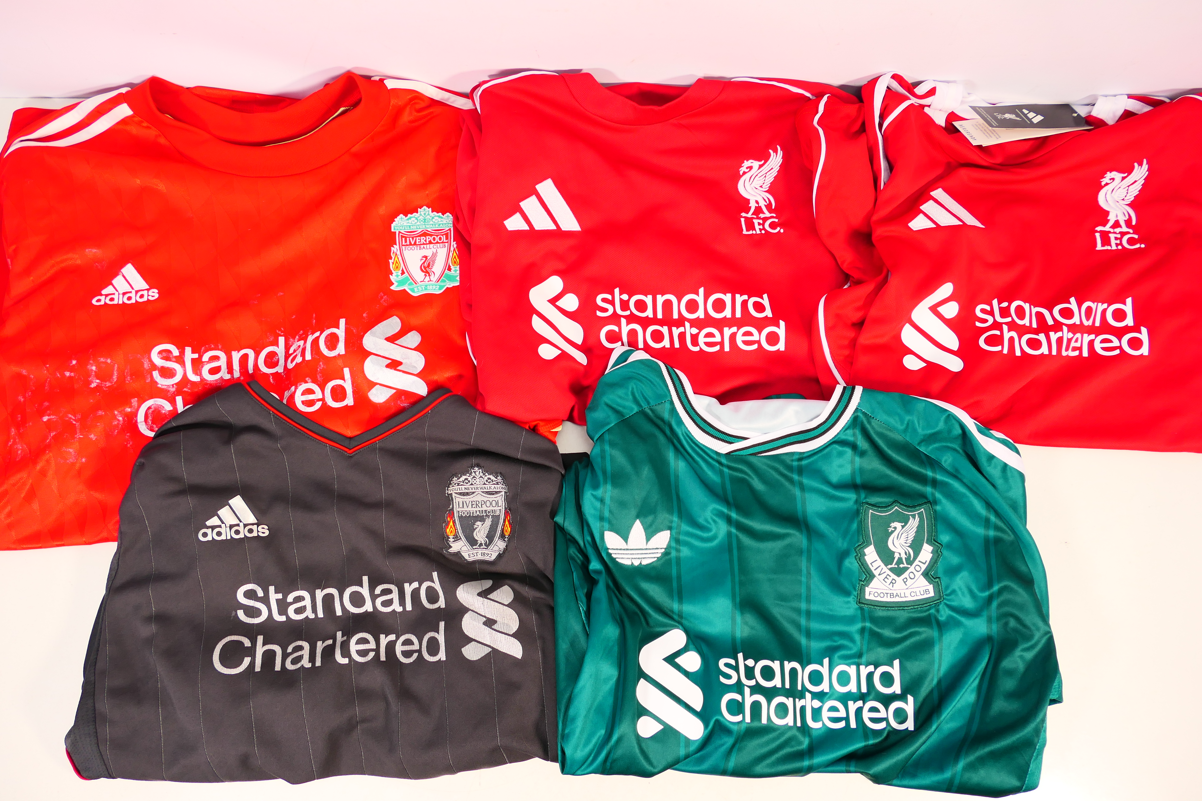 Liverpool Football Club - Five replica football shirts, all with Standard Chartered sponsorship,