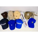 A collection of baseball caps to include Adidas,