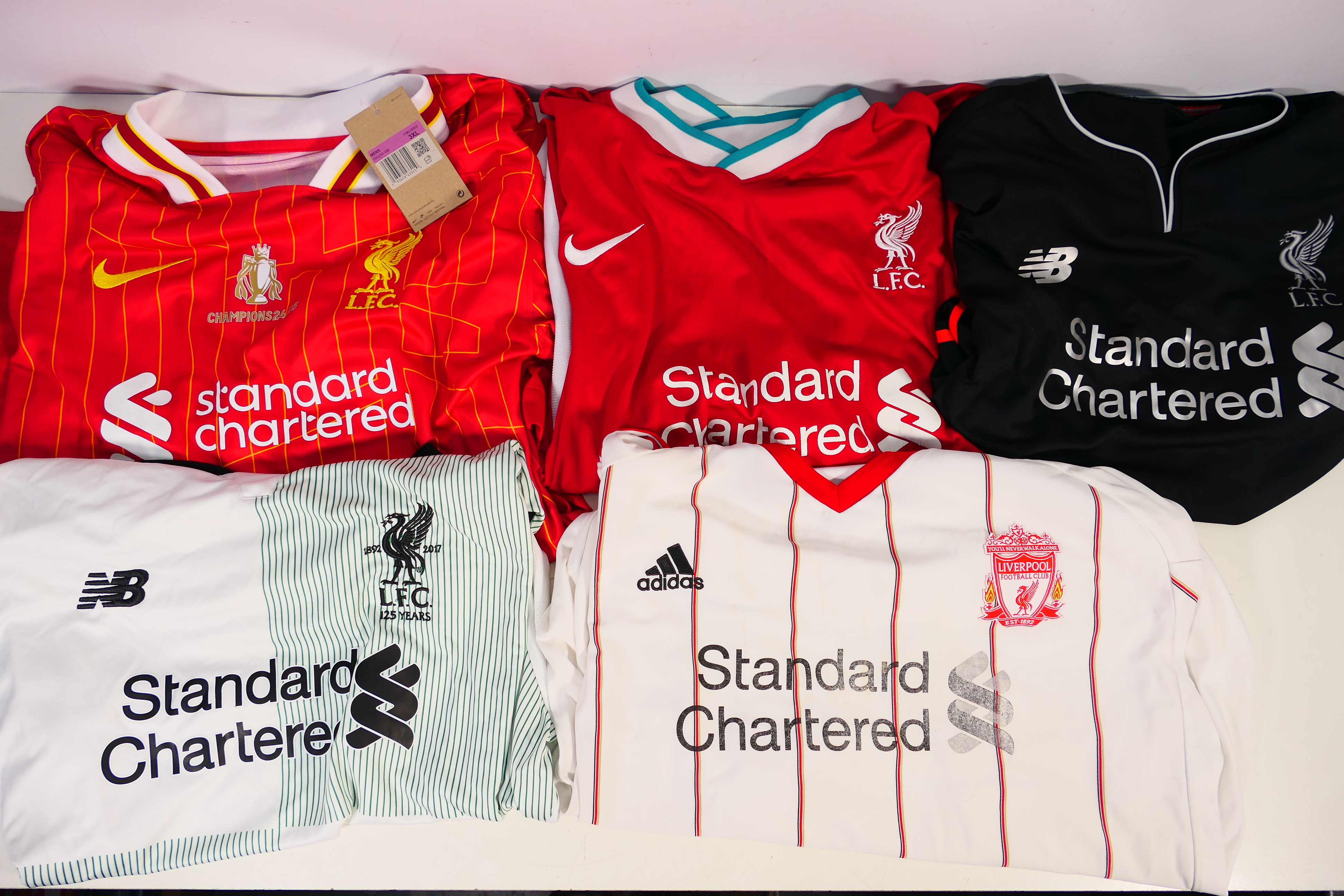 Liverpool Football Club - Five replica shirts, all with Standard Chartered sponsorship,